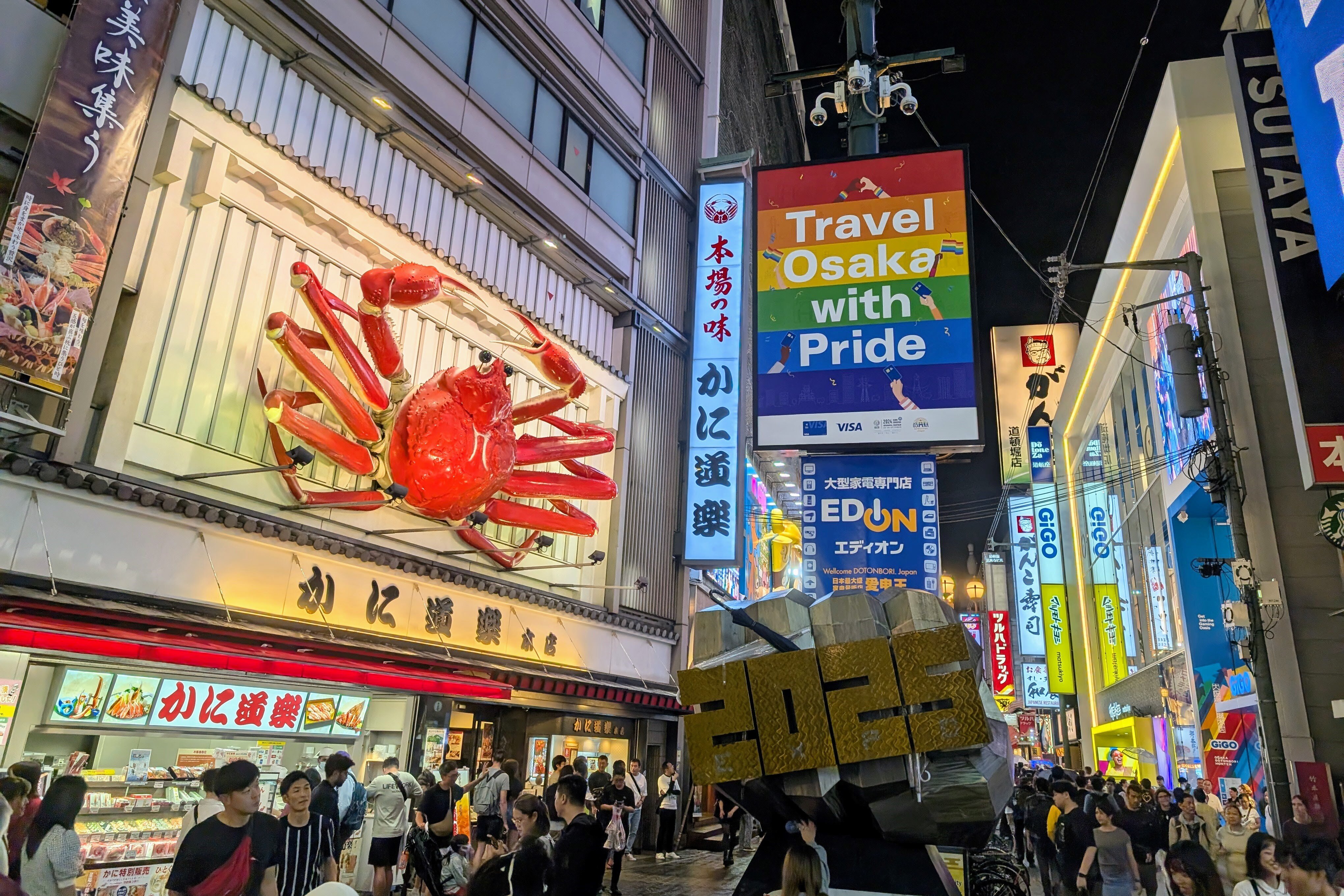 travel Osaka with pride campaign poster in Dotonbori