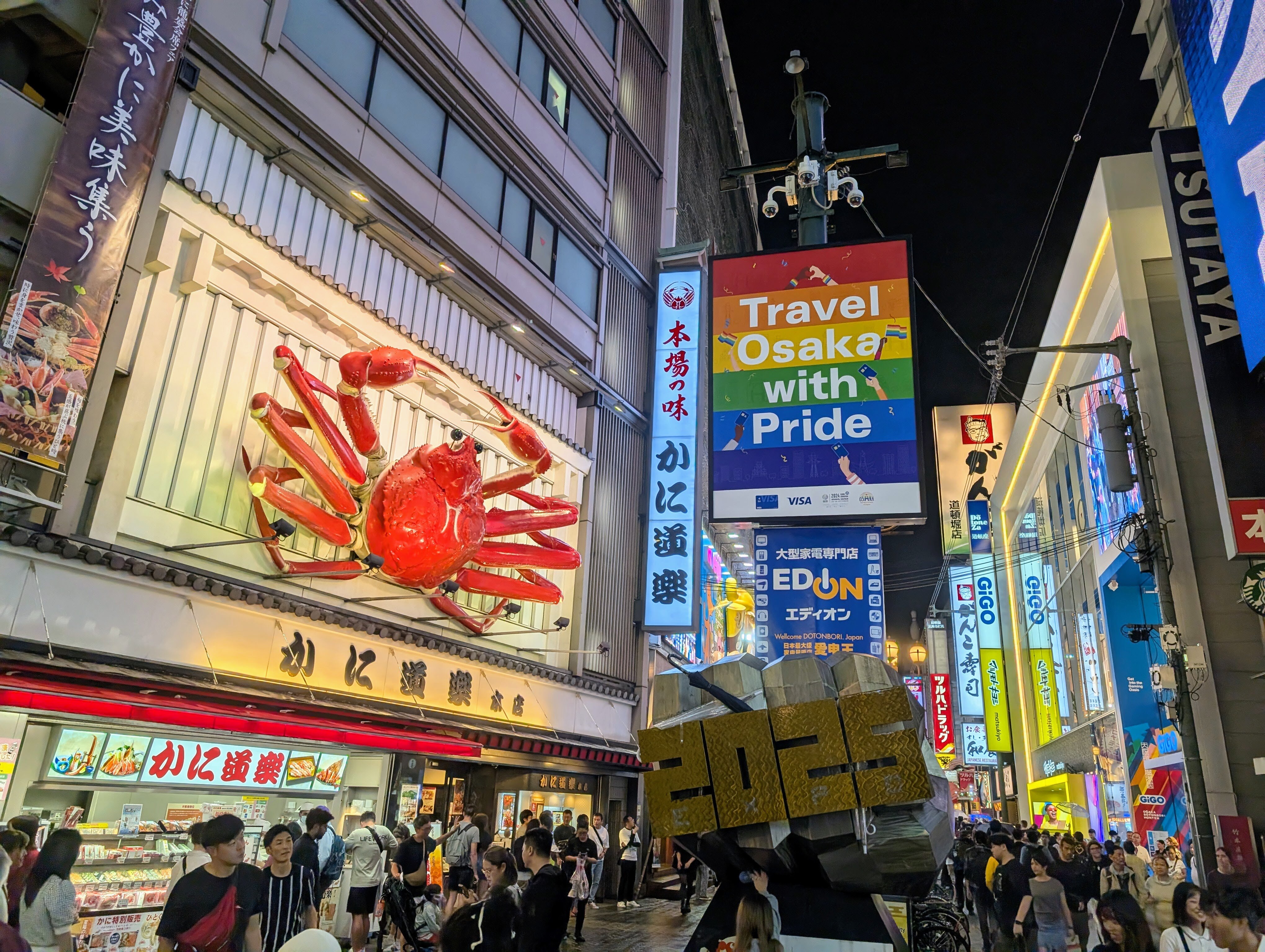 Travel Osaka with Pride message in Dotonbori